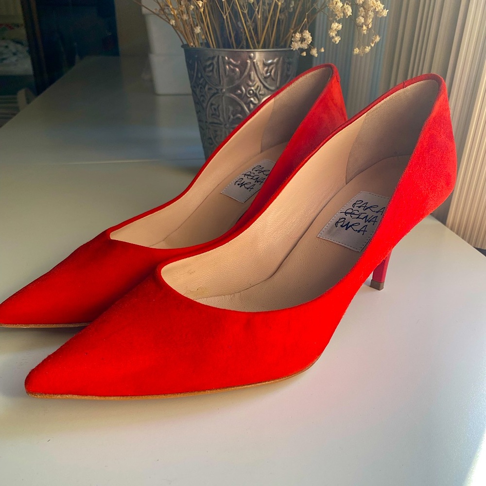 Red suede pumps